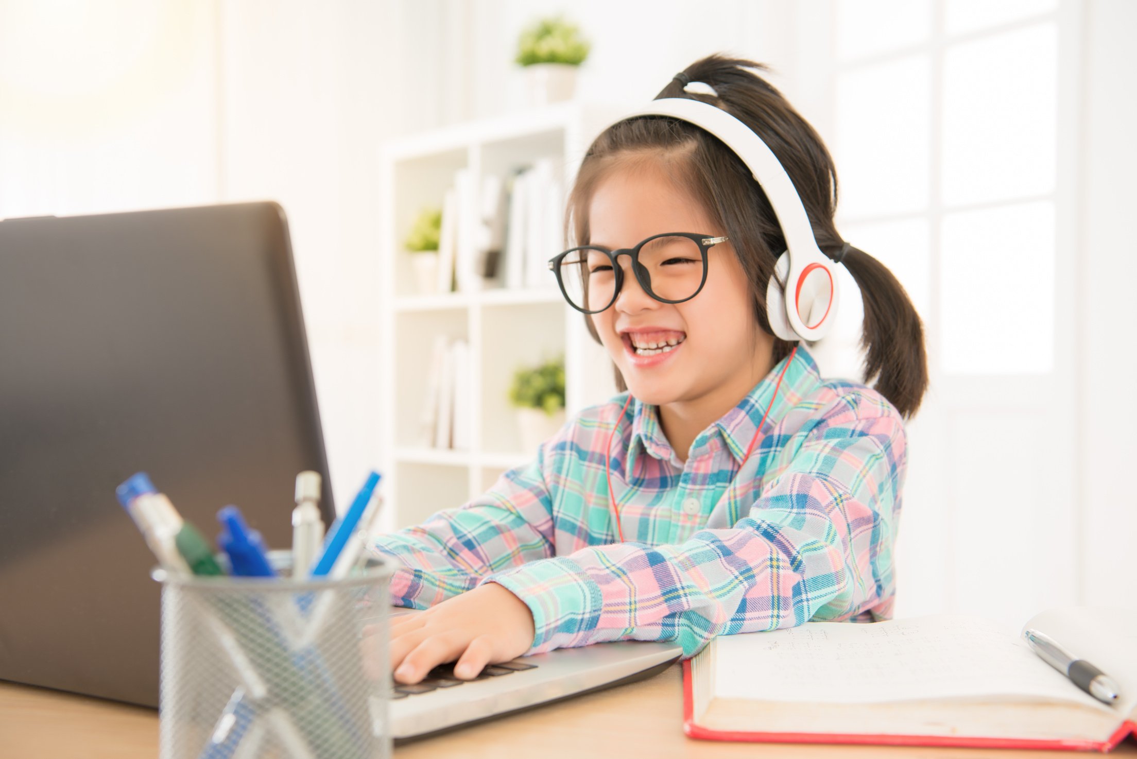 Happy Glasses Kid Playing Computer